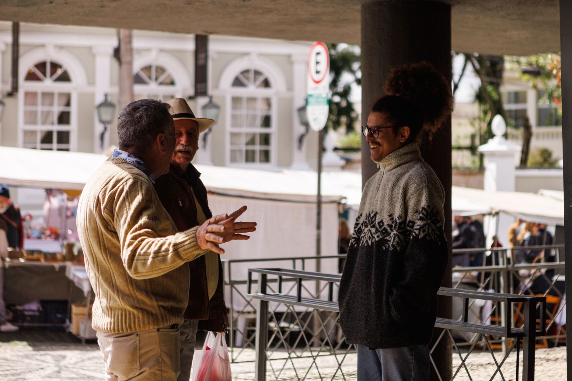 Men talking in an outdoor market