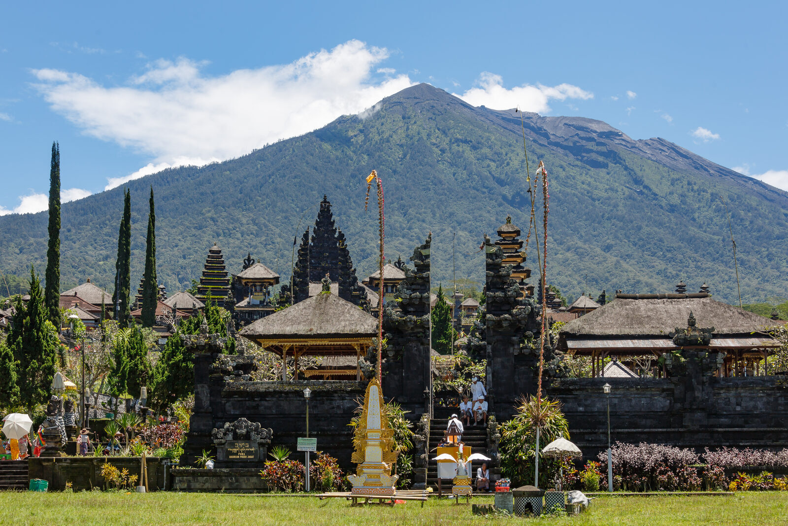 Besakih from below with Mount Agung filling the sky behind it — the volcano the whole temple is built to face.