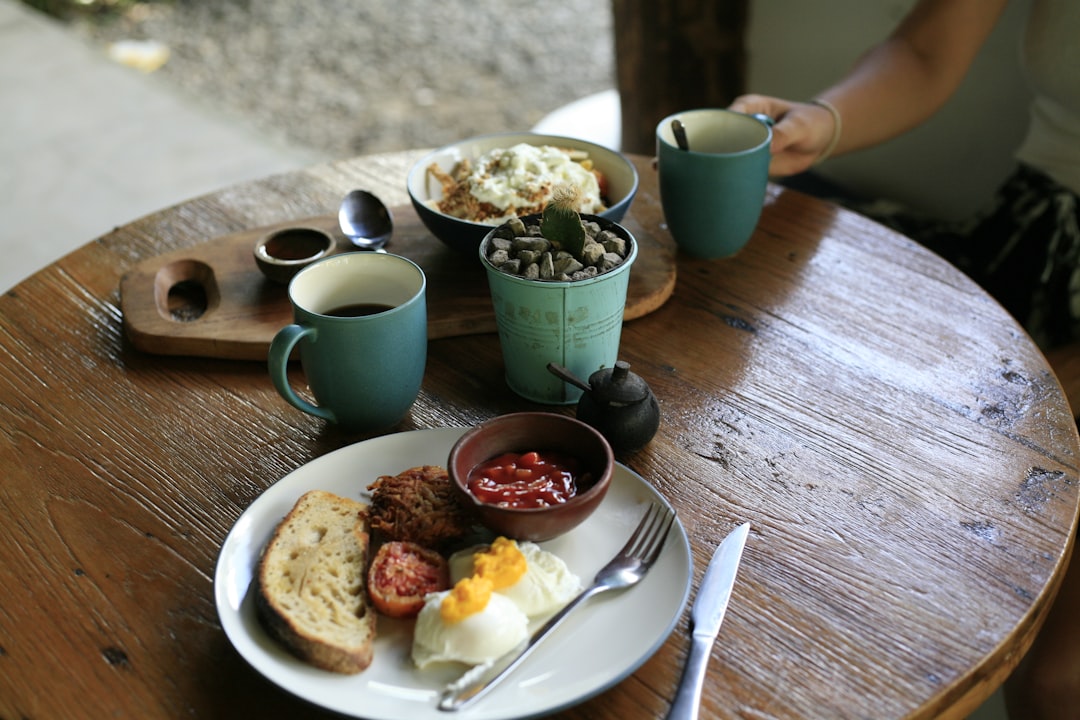 A flight of little tasting cups on a terrace with breakfast