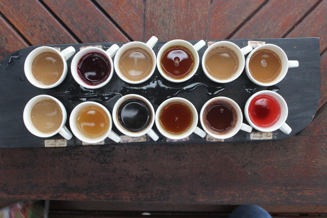 A tasting board of a dozen small cups of coffees and herbal teas