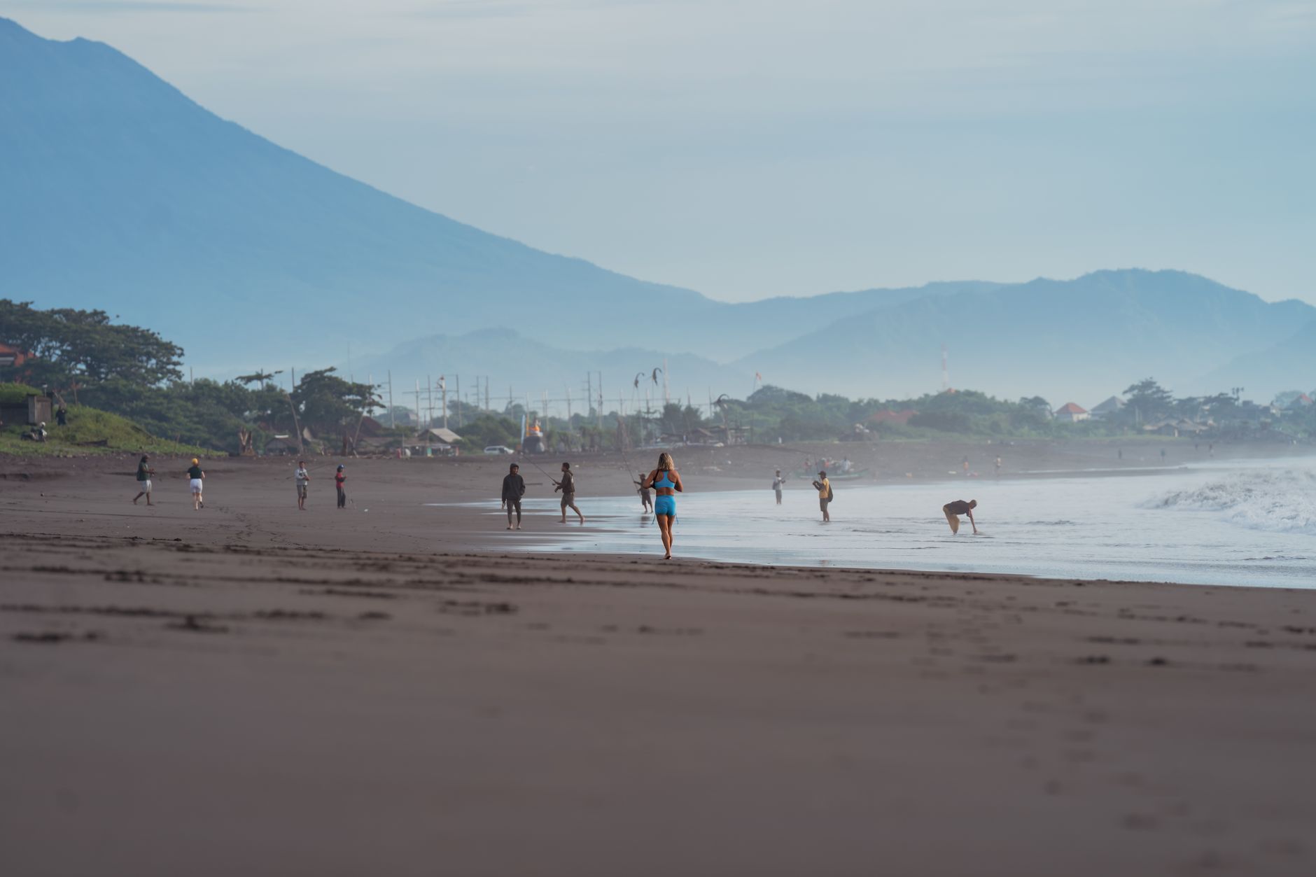 A quiet walk along Sanur beach with Mount Agung on the horizon