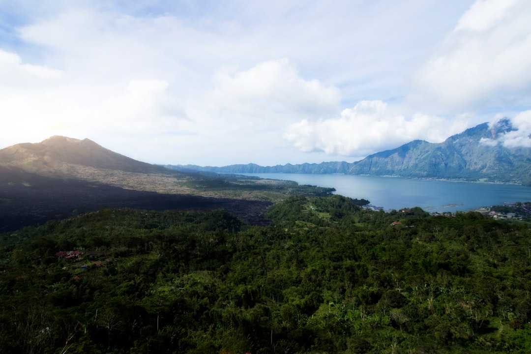 Mount Batur and its crater lake from the Kintamani rim, where the downhill starts