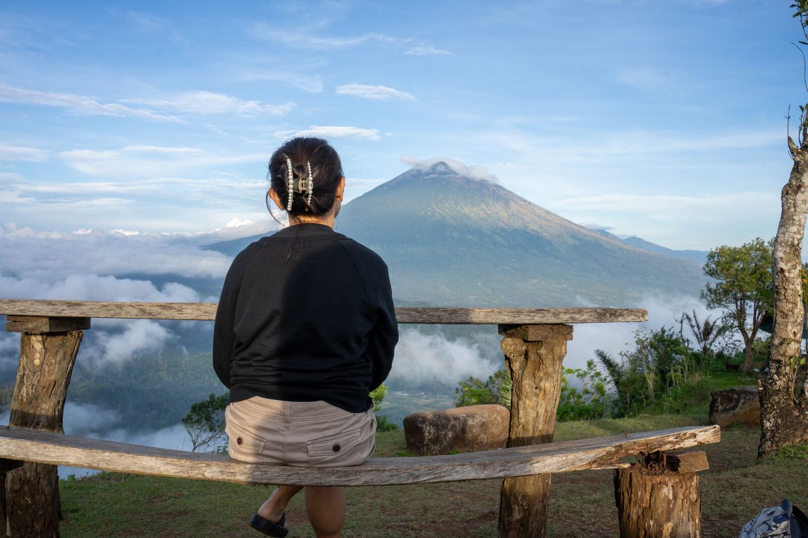 A bench with the volcano for a view — the kind of thing the slow east does well.