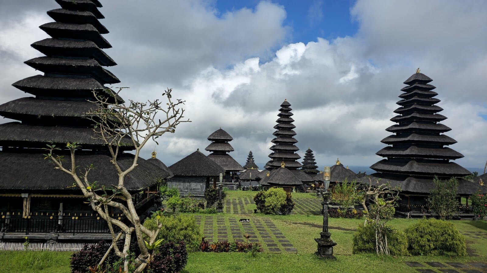 The complex and its towers with the hills rising behind.
