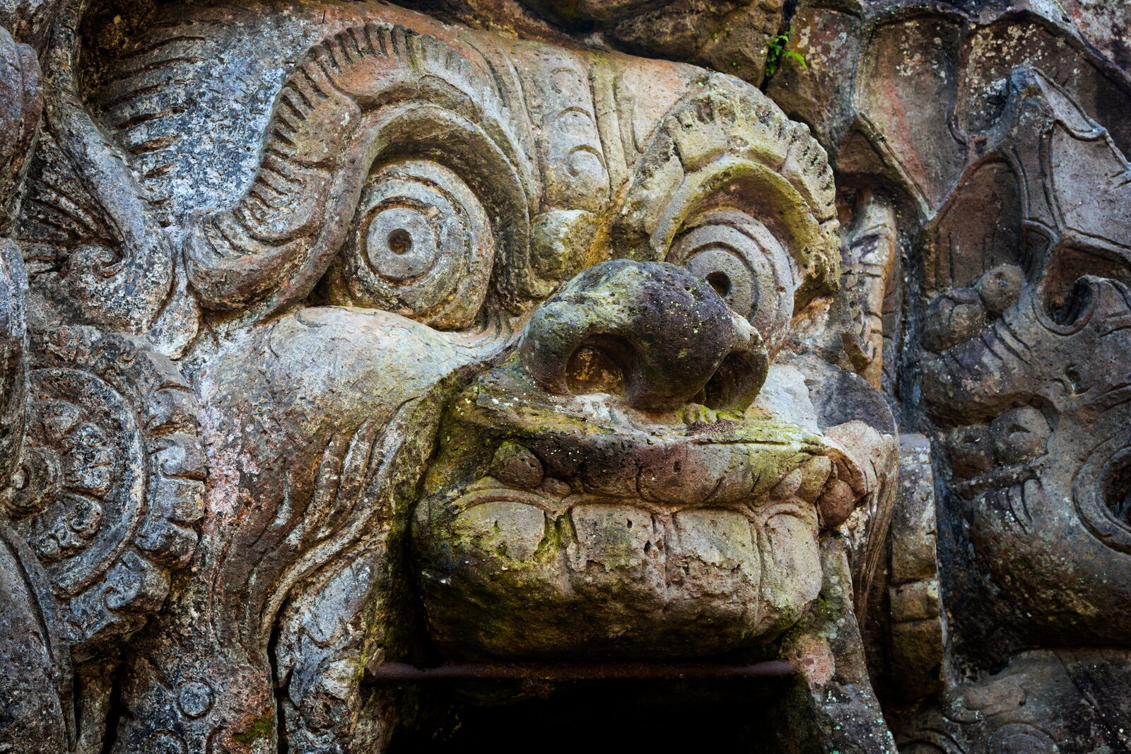The same menacing face, lichen-streaked and worn by a thousand years of valley damp.