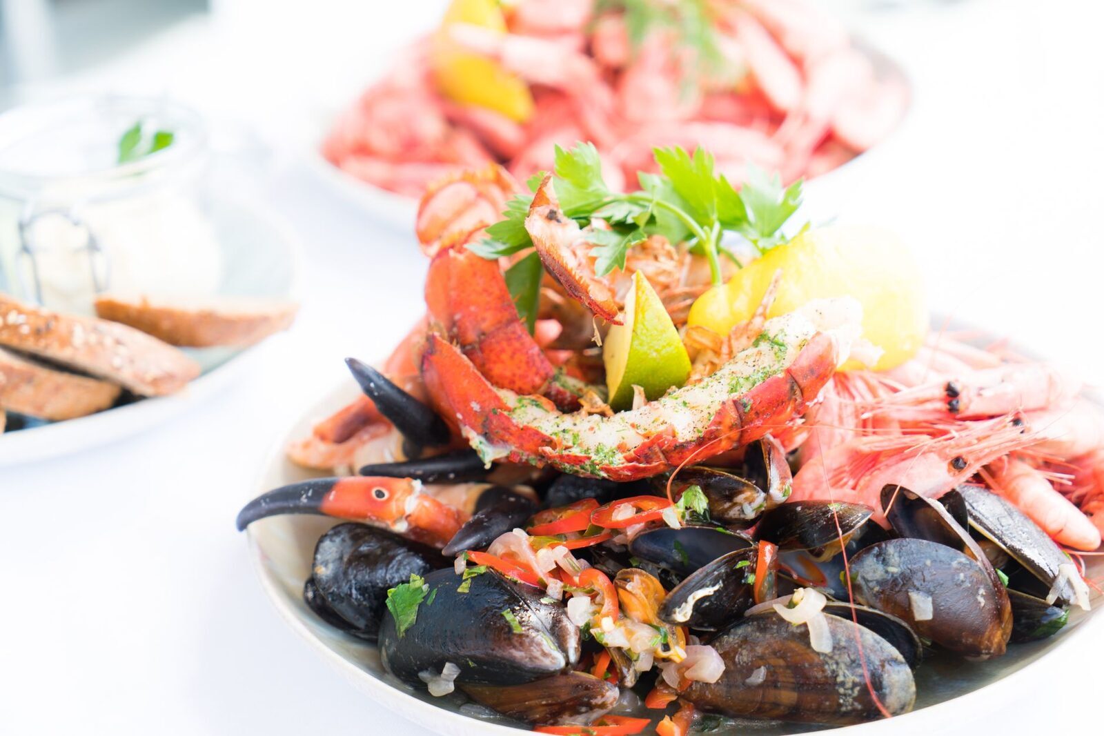 A mixed seafood plate of prawns, mussels and lobster.