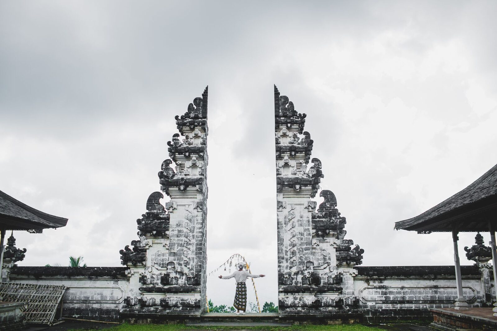 The scale of the gate against a lone figure, on a quieter, overcast morning.