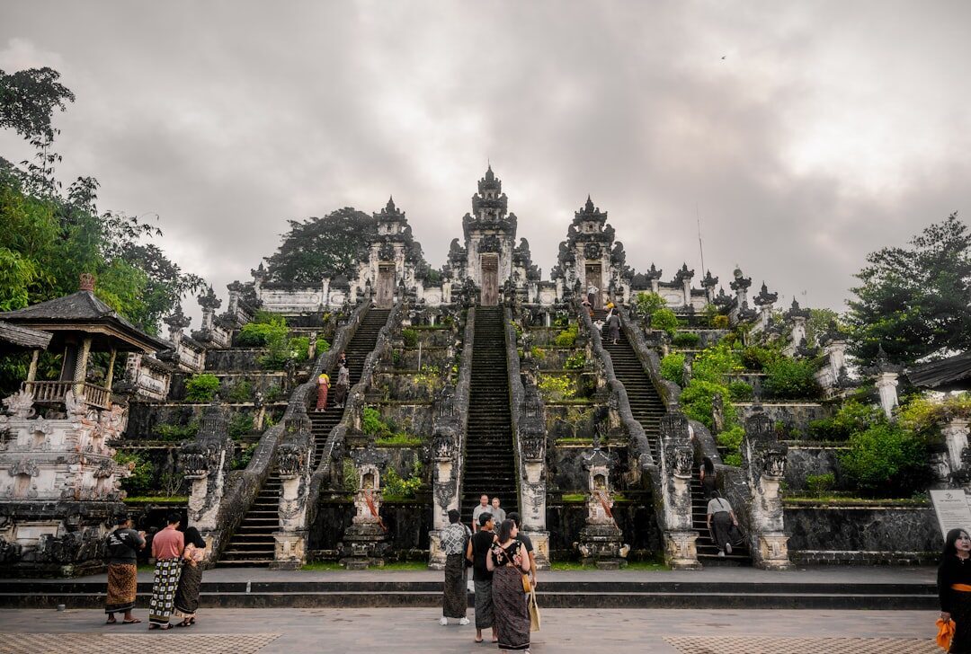 Worshippers and visitors gather at the foot of the grand stairway — on a busy morning the wait for the gate photo can run one to three hours.