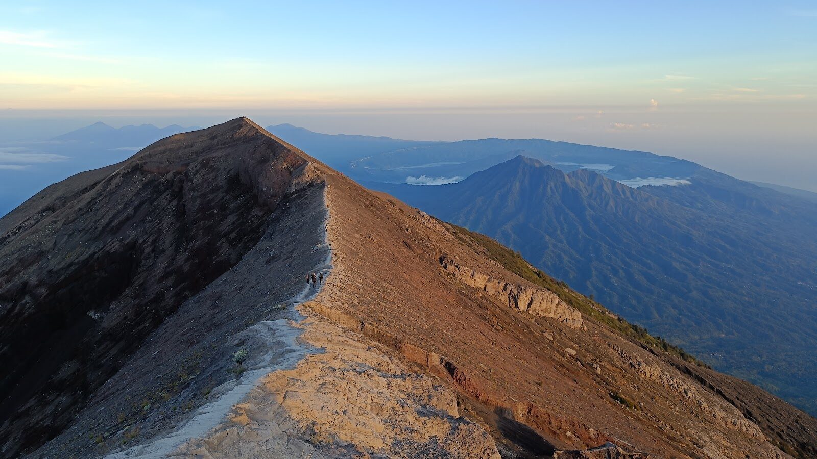 The upper route to the summit — a spine of loose scree and rock, the kind of ground you cross in the dark before dawn.