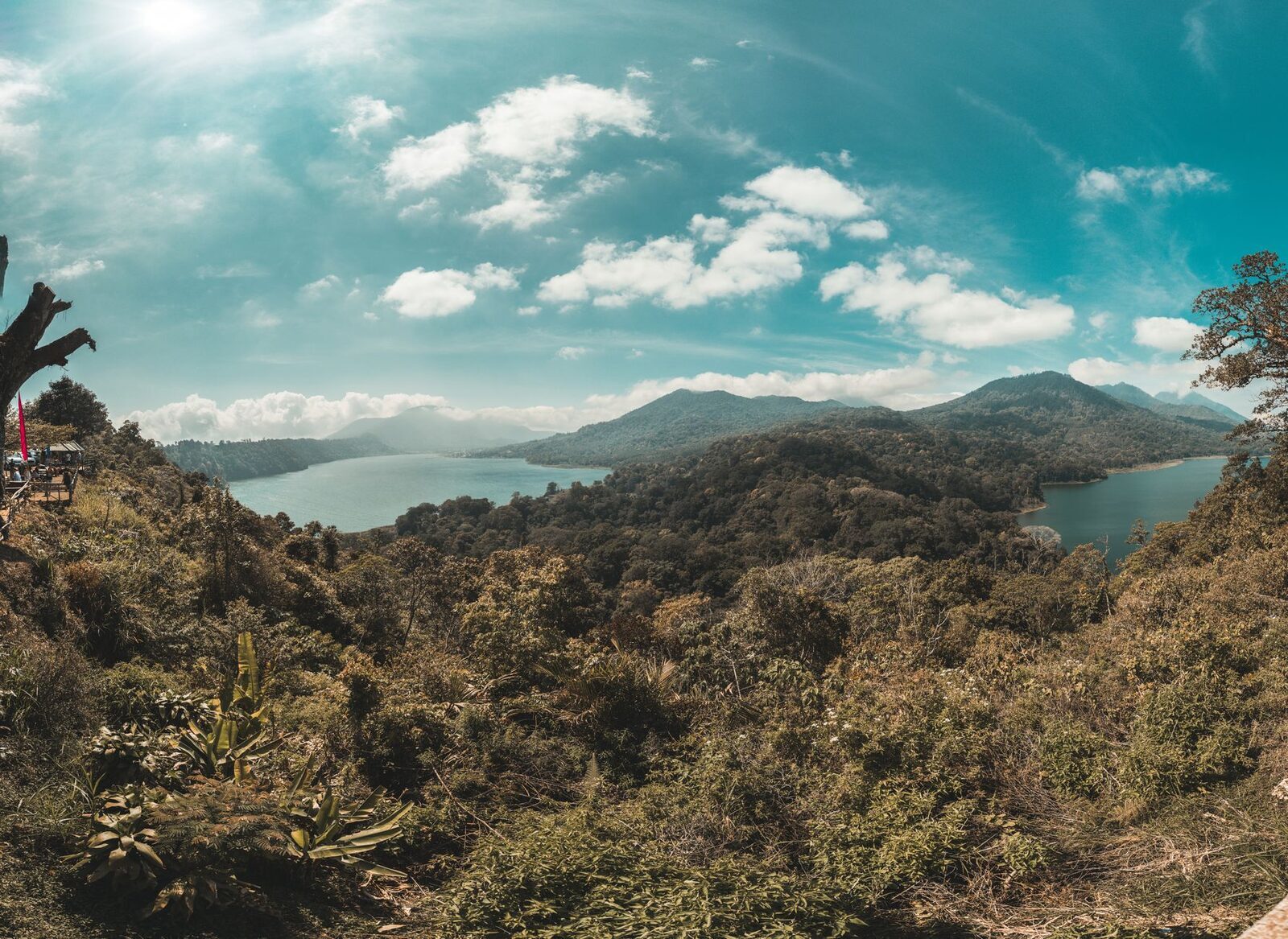 Looking down over the caldera lakes from above, ringed in unbroken green.