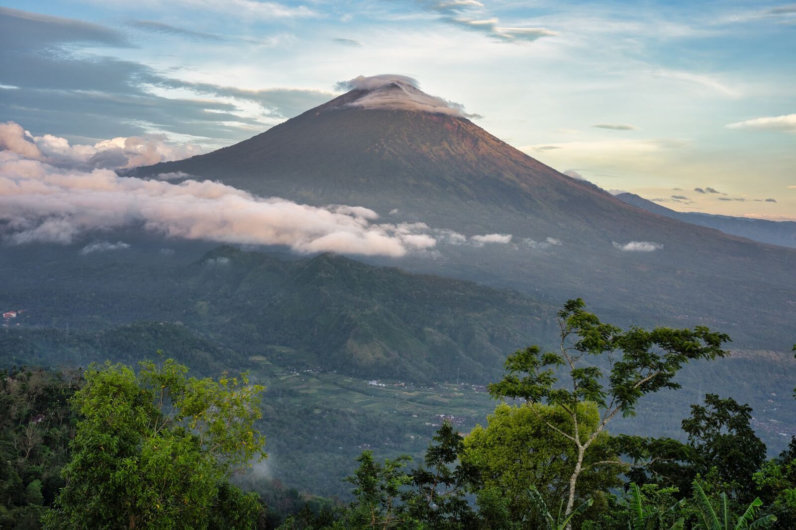 A volcano peak riding clear above the cloud, the way the highlands look on a good morning.