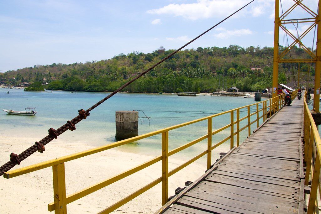 The yellow bridge seen from the Ceningan shore.
