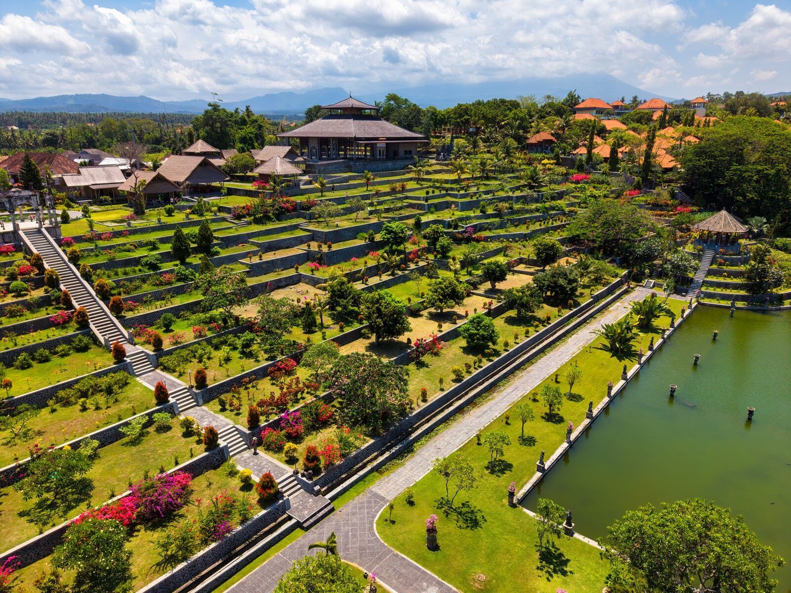 Aerial over the terraced gardens climbing the hill behind the ponds — the quieter upper level most people skip.