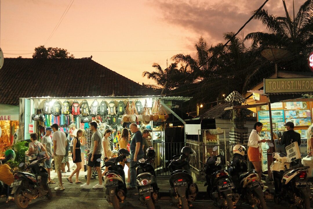 Market stalls glowing at dusk in the town centre.