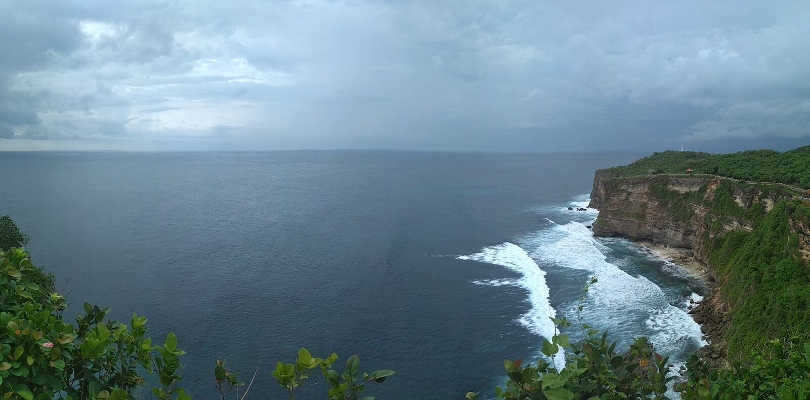 The cliffs below the temple, the Indian Ocean grey and heavy under cloud.