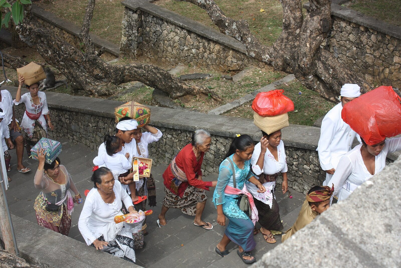 A woman carrying temple offerings at Pura Luhur Uluwatu
